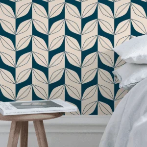 geometric green leaf wallpaper behind bed and nightstand