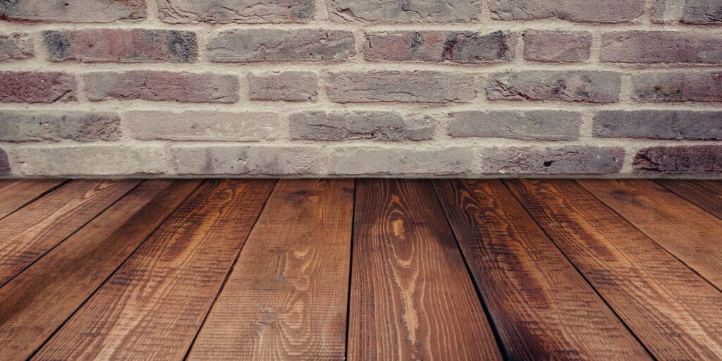 Wood flooring with brick wall