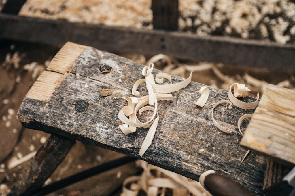 cradle to cradle reclaimed wood on sawhorses with wood shavings