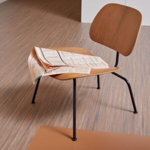 brown earth toned linoleum flooring with modern chair