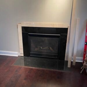 Fireplace with wooden brace frame prepping the wall for our DIY fireplace surround