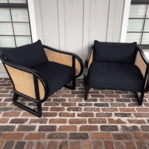 two black cane chairs with black cushions