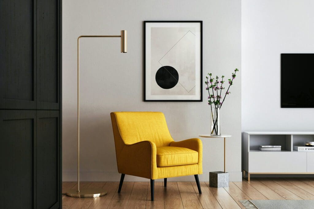 yellow chair with artwork in modern interior design style